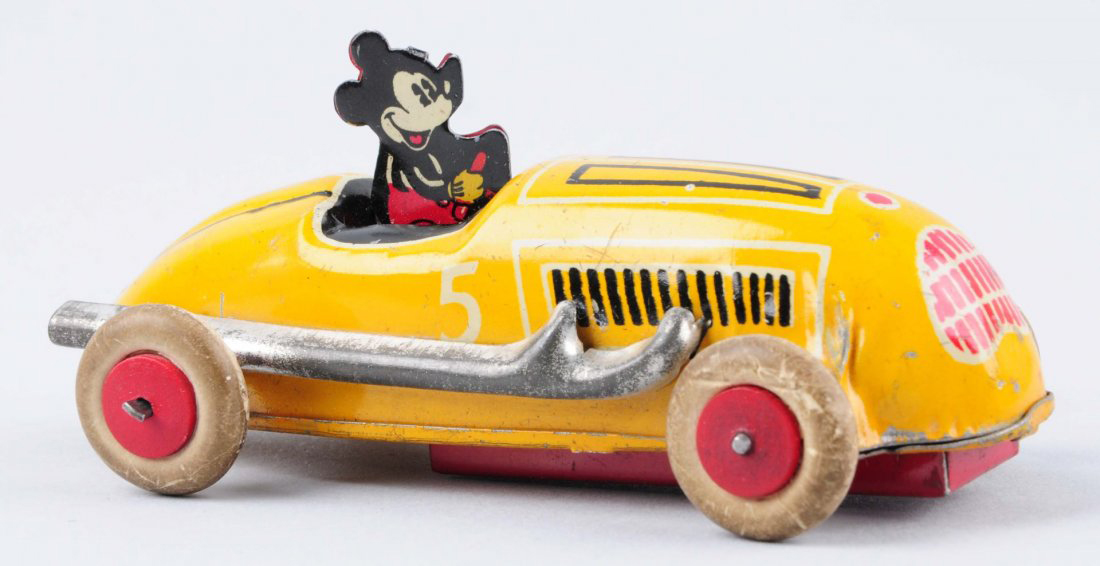 Mickey Mouse tin racecar with white rubber wheels, key included, est. $200-$400. Morphy Auctions image