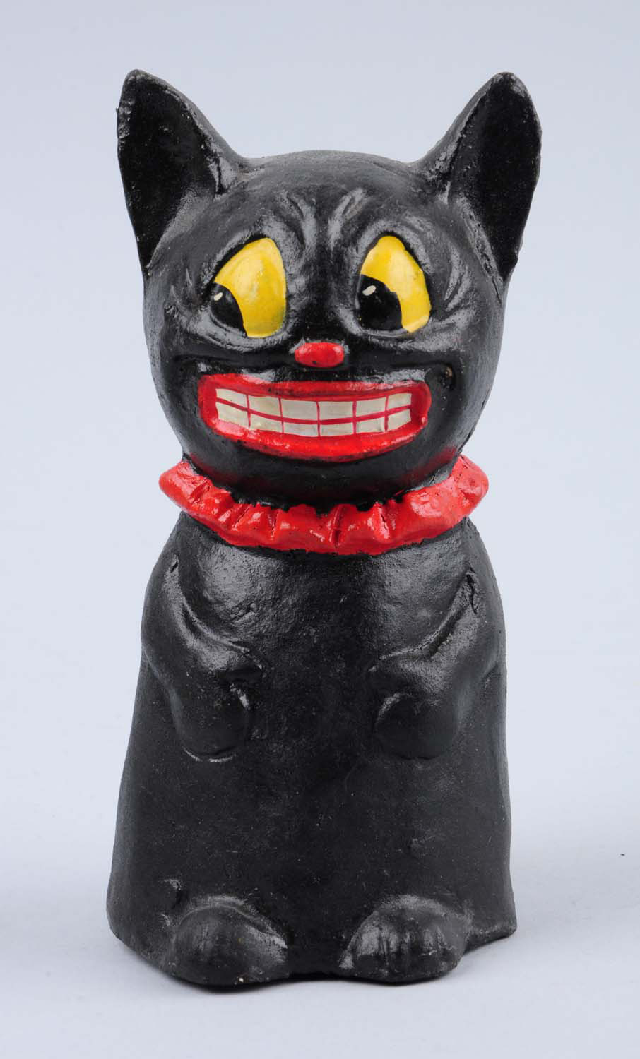 Papier-mache black cat candy container, 6 inches tall, excellent paint, est. $200-$400. Morphy Auctions image