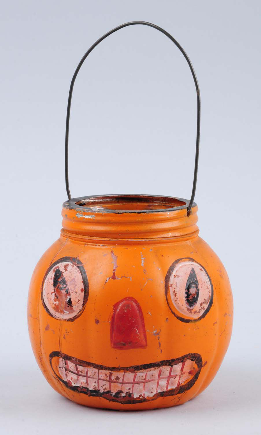 Painted glass pumpkin head Halloween candy basket, est. $100-$200. Morphy Auctions image