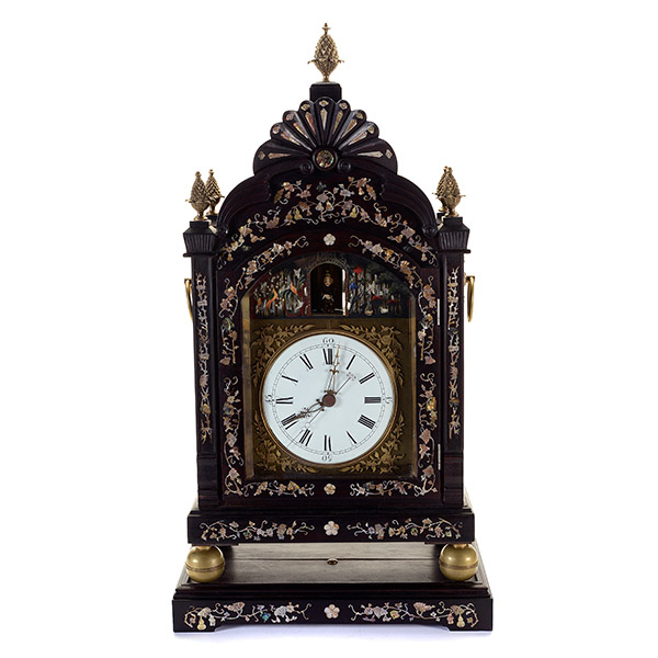 Chinese Export mother-of-pearl inlaid rosewood automaton bracket clock on a matching revolving stand. Price realized: $10,620. Michaan's Auctions image