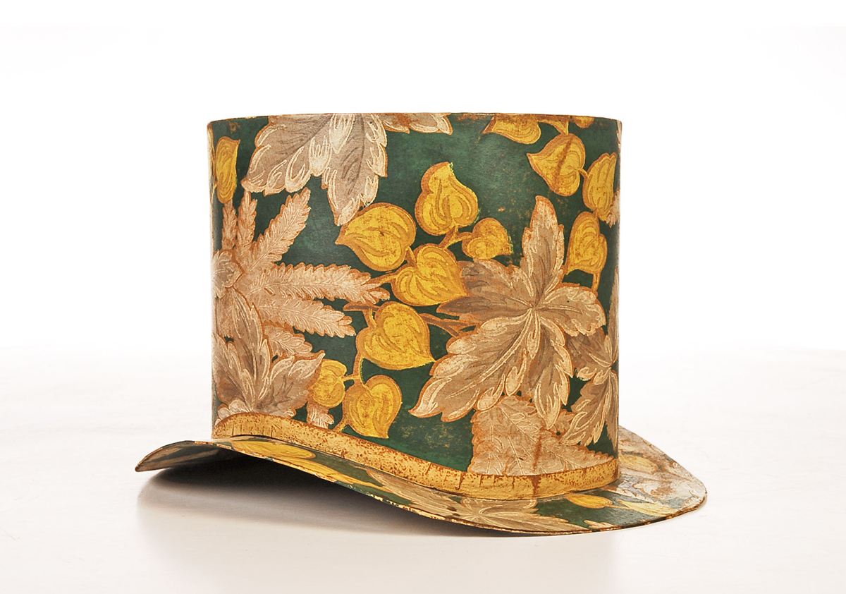 Ever see an antique top hat covered with old wallpaper? This 8-inch-high top hat is lined with an 1814 newspaper that mentions the nominee for governor of Massachusetts. Perhaps it was worn at a political party. But although the hat was well cared for during the past 200 years, its use remains a mystery.