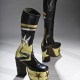 Toronto shoemaker Master John made these men’s platform boots complete with 5 1/2-inch heels, appliquéd stars, and veritable landscape in leather. In the 1970s, some men followed the lead of rock stars in adopting lavish personal adornment and elevating shoes cultivating a persona at once dandyish and hyper-masculine. Collection of the Bata Shoe Museum. Photo credit: Image © 2015 Bata Shoe Museum, Toronto, Canada