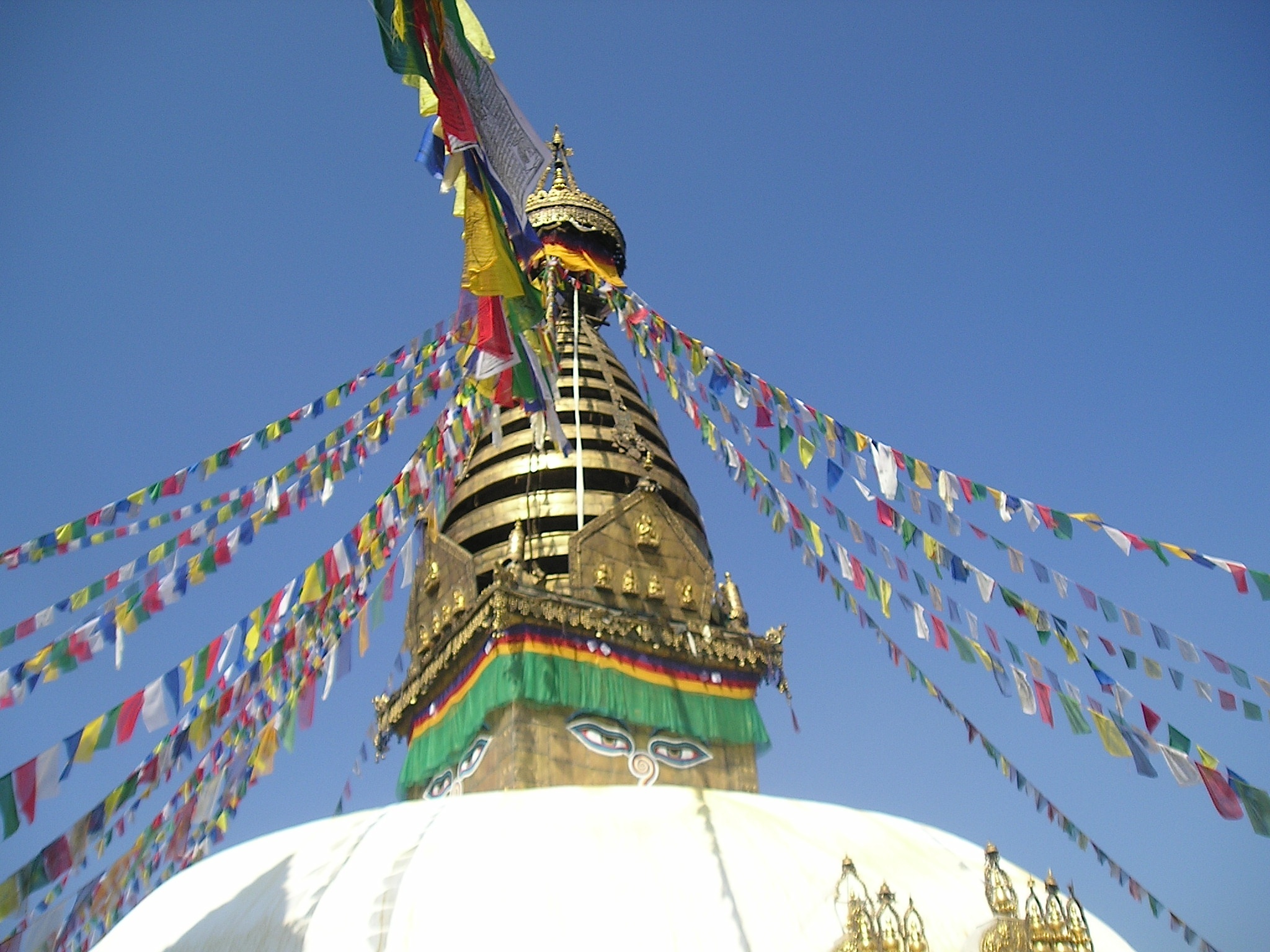 Swayambunath stupa and prayer flags in Kathmandu, Nepal. Image by Nancy Collins. This file is licensed under the Creative Commons Attribution-Share Alike 3.0 Unported license.