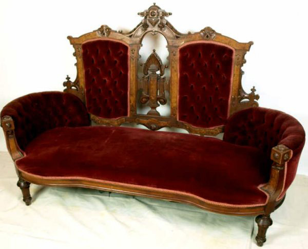 This settee is typical of seating of the Victorian period – stiff, uncomfortable and loaded with architectural add-ons. Image courtesy of LiveAuctioneers.com