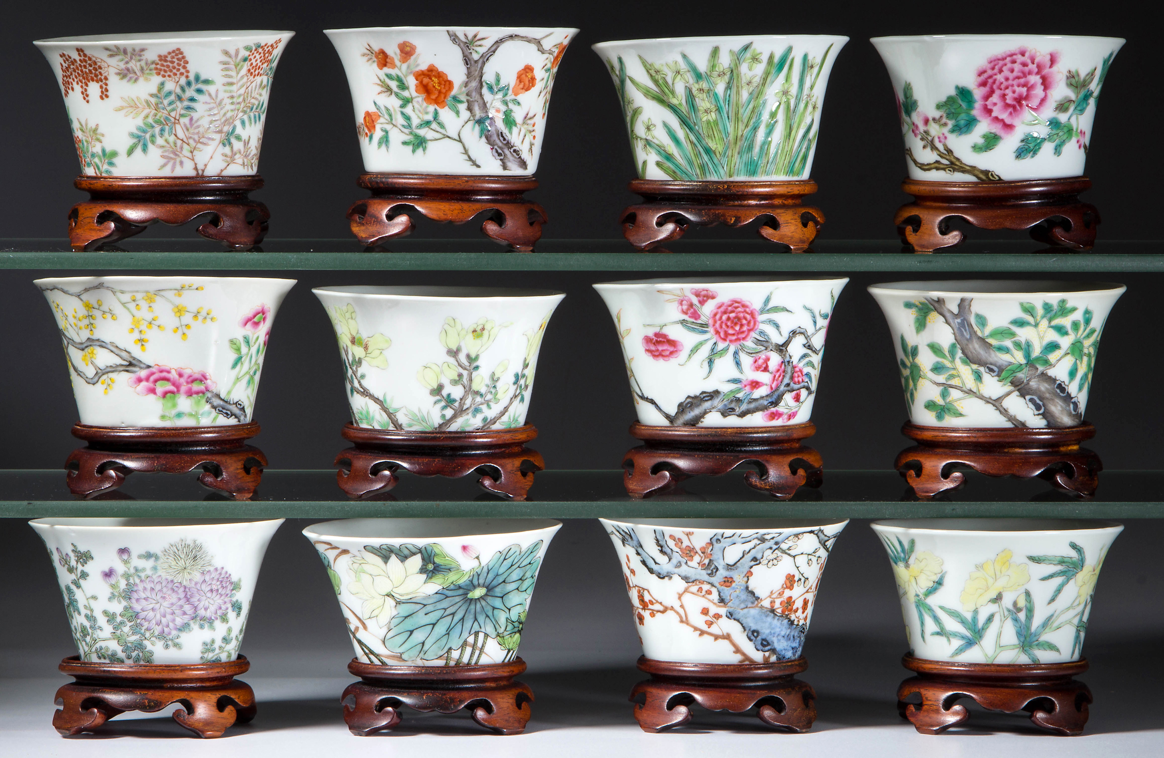 This set of 12 Chinese Famille Rose porcelain months of the year tea bowls sold for  $21,850. All prices include the 15 percent buyer’s premium. Jeffrey S. Evans & Associates images 