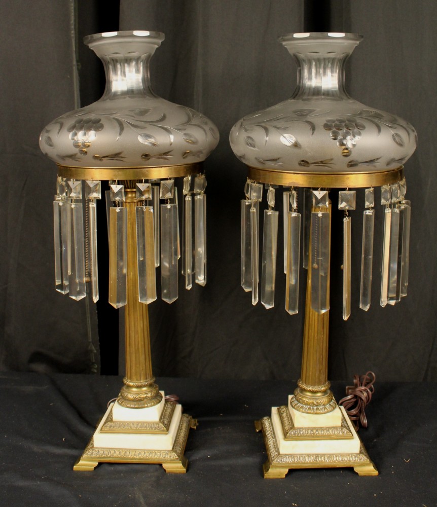 An early pair of matched sinumbra lamps on two-step step marble bases and 10-inch shades, standing 27 inches high. Stevens Auction Co. image