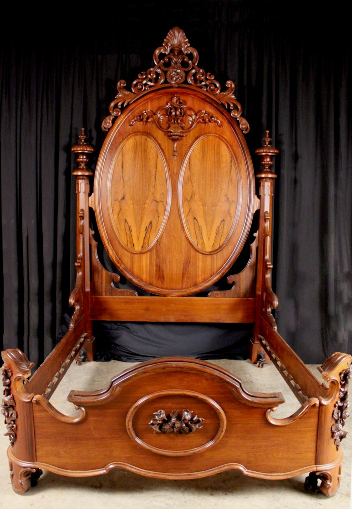 Made in Cincinnati, a magnificent Mitchell & Rammelsberg rosewood queen-size bed an impressive 9 feet 11 inches tall. Stevens Auction Co. image