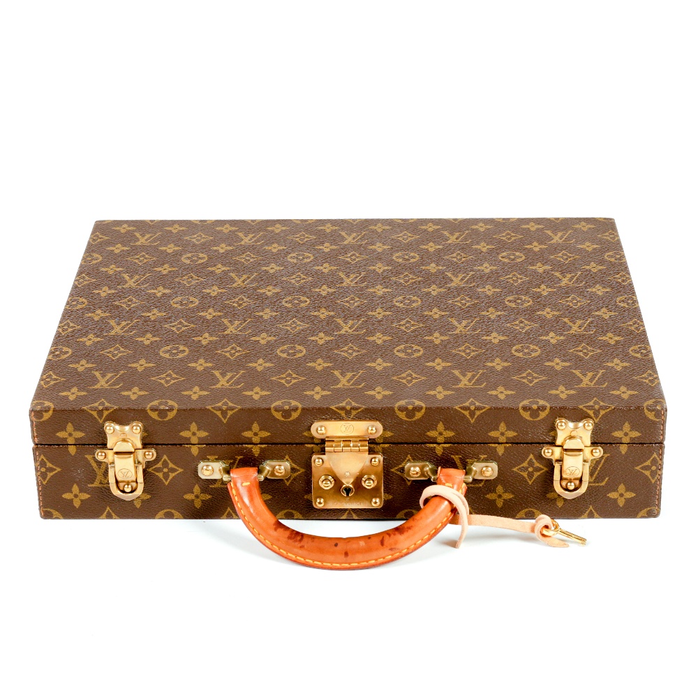 Luxury accessories in the sale include this Louis Vuitton monogram Rigid briefcase. Fellows image