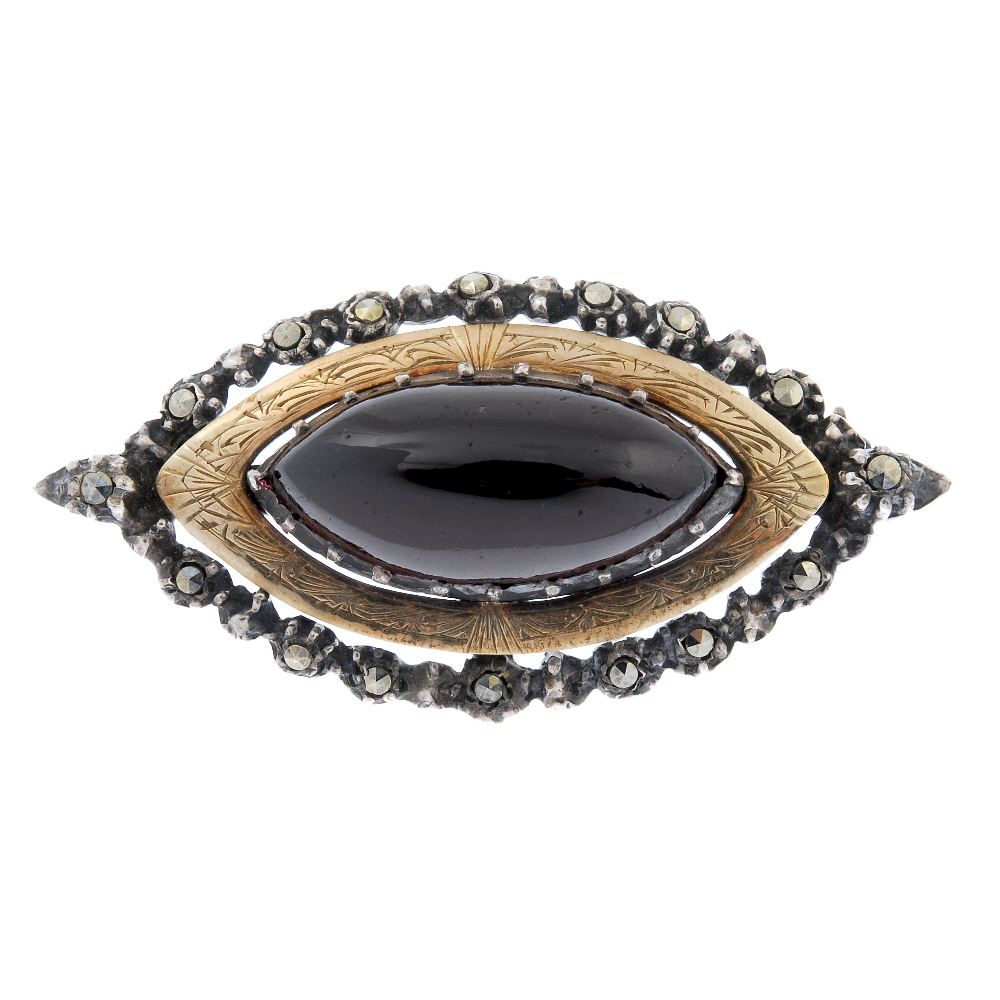 Favored by Arts & Crafts followers is this Sibyl Dunlop designed silver garnet and marcasite brooch. Fellows image
