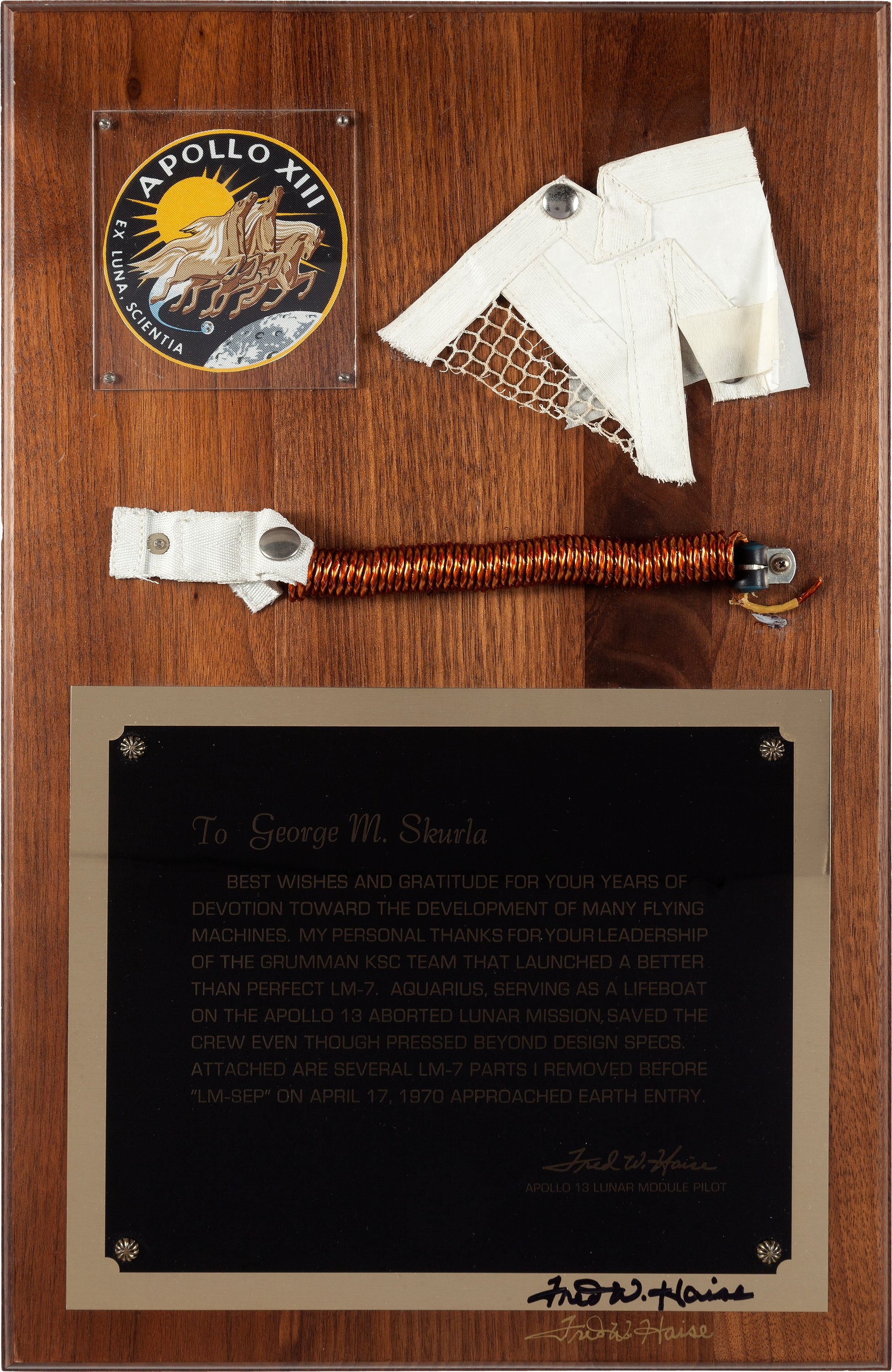 Mounted on a plaque as presented by astronaut Fred Haise to lunar module maker Grumman's George M. Skurla, the material is united by an engraved plate on which Haise thanks Skurla for saving the life of the crew with his incredible spacecraft. The presentation piece sold for $12,500. Heritage Auctions image