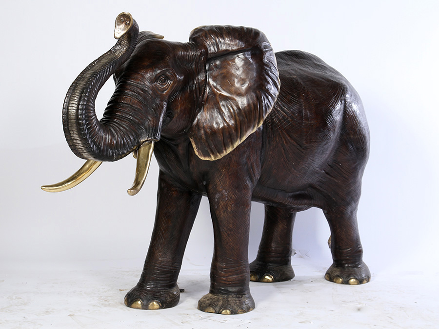 Standing 48 inches tall, this bronze elephant having an upraised trunk doubles as a garden fountain (est. $1,000-$1,500). Kamelot image