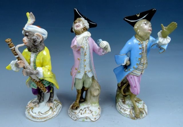 Three Meissen porcelain monkey musicians, 5 1/2in to 5 34in, professional restorations noted. Estimate: $1,800-$2,200. Don Presley Auction image