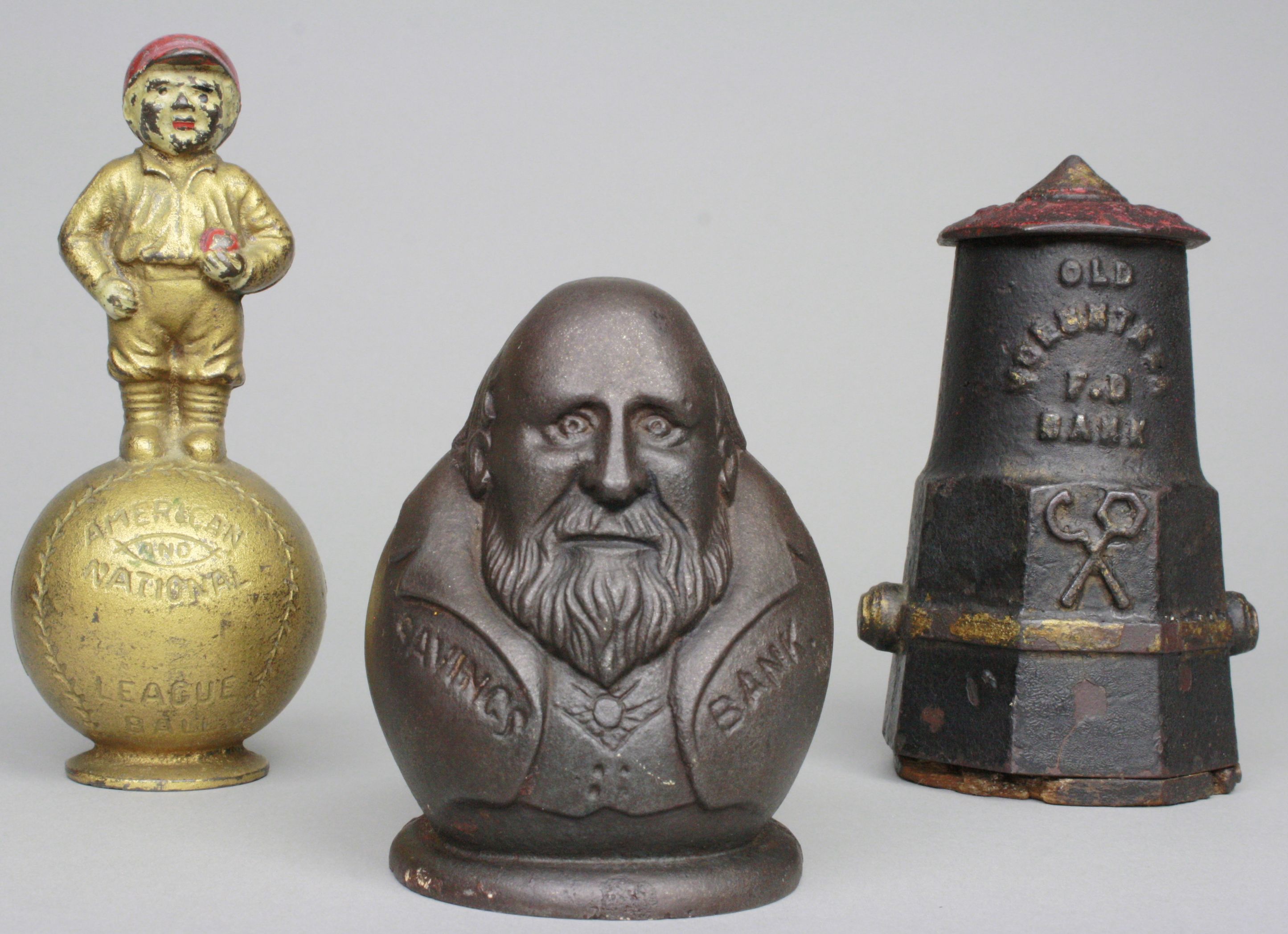 Seldom-seen still banks including (left to right) Mascot, Tammany Tiger, and Old Volunteer F.D. Fire Plug. RSL Auction image