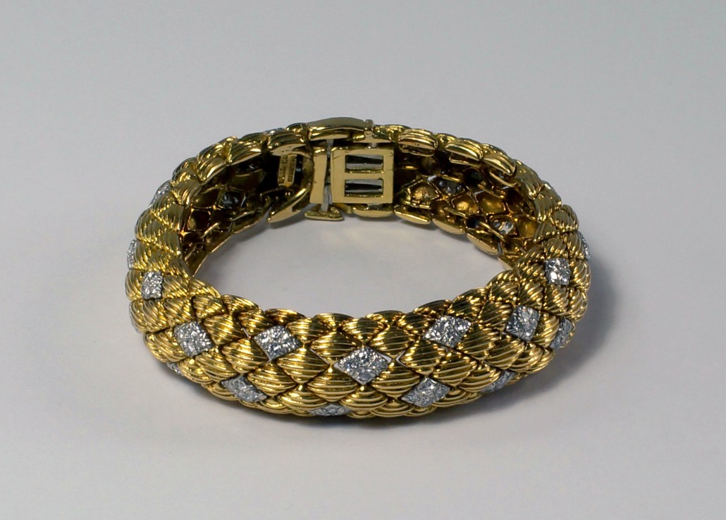 Signed by Webb, this 18K gold, platinum and diamond set bracelet is estimated to sell for £5,000-8,000. Roseberys image