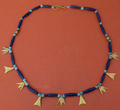 Egyptian faience and gold necklace with lotus and flies amulets, circa 1570-1320 B.C. Estimate: $6,000-$6,000. Artemission image