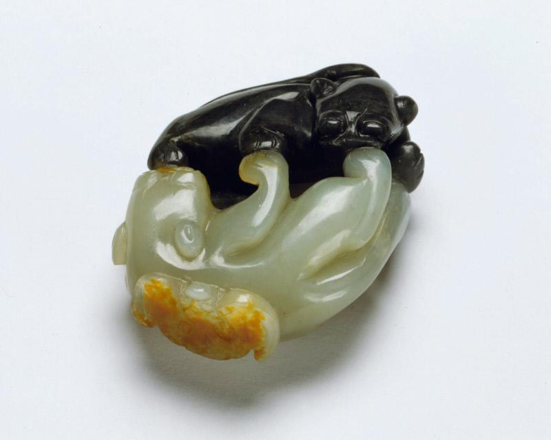 Variations in color on a piece of nephrite jade often inspired craftsmen; this unusual stone became light and dark cats playing while a rust-colored bat flutters at one end. The Qing dynasty sculpture is one example from a large collection formed by Avery Brundage (1887-1975), which became the foundation of the Asian Art Museum in San Francisco. Courtesy: Asian Art Museum.