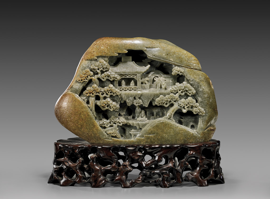 Large Chinese carved celadon jade mountain, 18 1/2in long, on openwork wood stand (est. $12,000-$15,000). I.M. Chait Gallery/Auctioneers