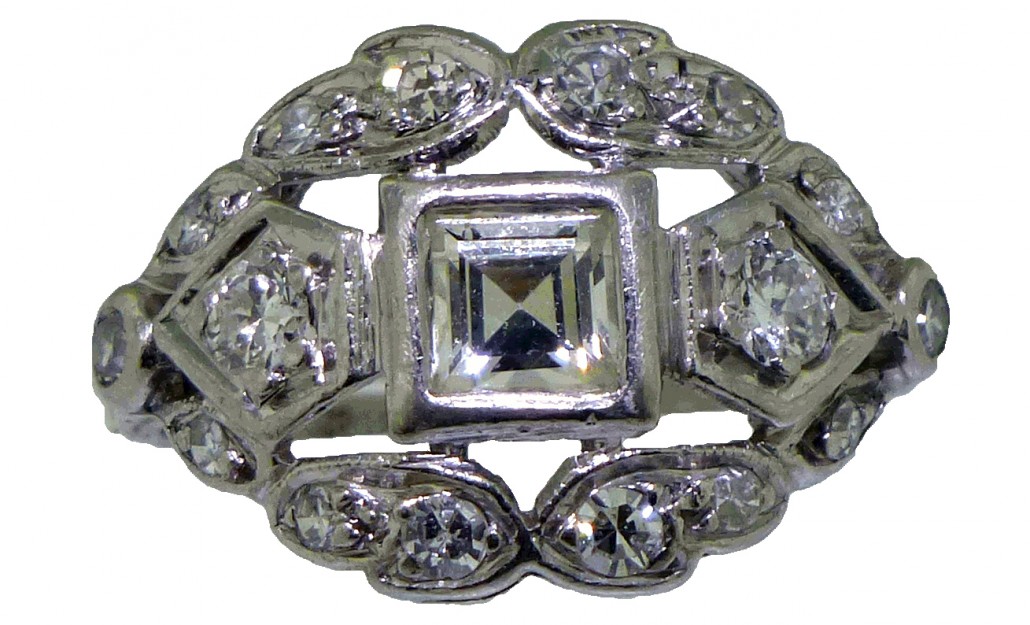 Exquisite Art Deco platinum and  diamond ring with center square step-cut diamond surrounded by round single-cut diamonds. Est. $1,500-$1,800. Charleston Estate Auctions image