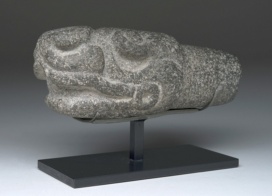 Veracruz (Mexico) volcanic stone hacha depicting stylized head of serpent, circa 700-900 CE, est. $6,200-$9,200. Artemis Gallery image