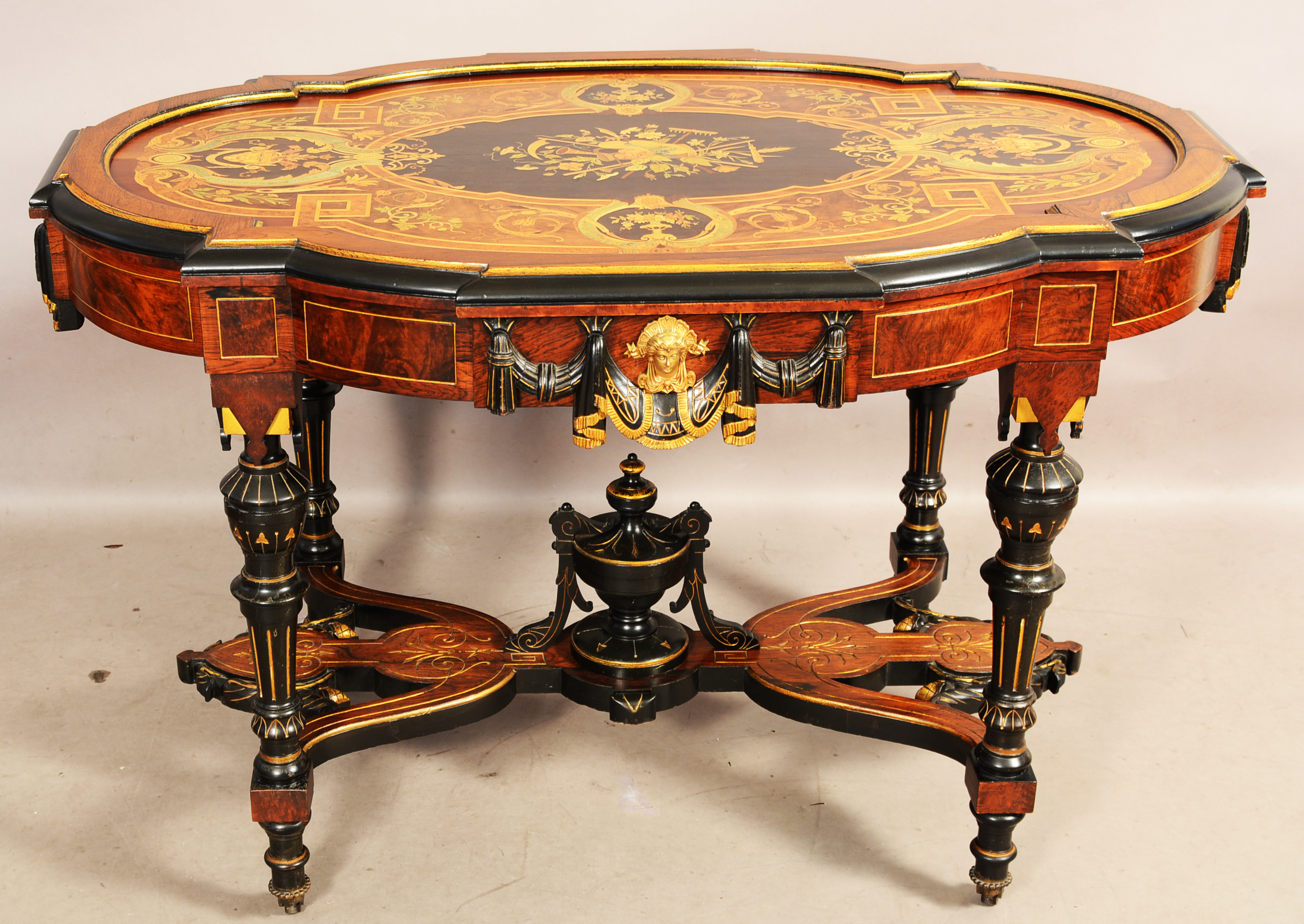 American Renaissance Victorian rosewood marquetry inlaid parlor table with bronze mounts, turned legs, carved stretcher and finials. Attributed to Herter Bros., New York, 31in high x 32in wide x 47 long. Estimate: $4,000-$7,000. Bruhns Auction Gallery image