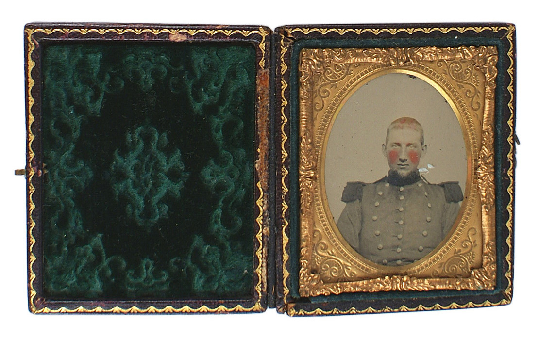 SONY DSCAmbrotype portrait of a young Confederate militiaman, housed in a floral decorated gilt frame and with a leather case. Prize realized: $488. Mohawk Arms Inc. image