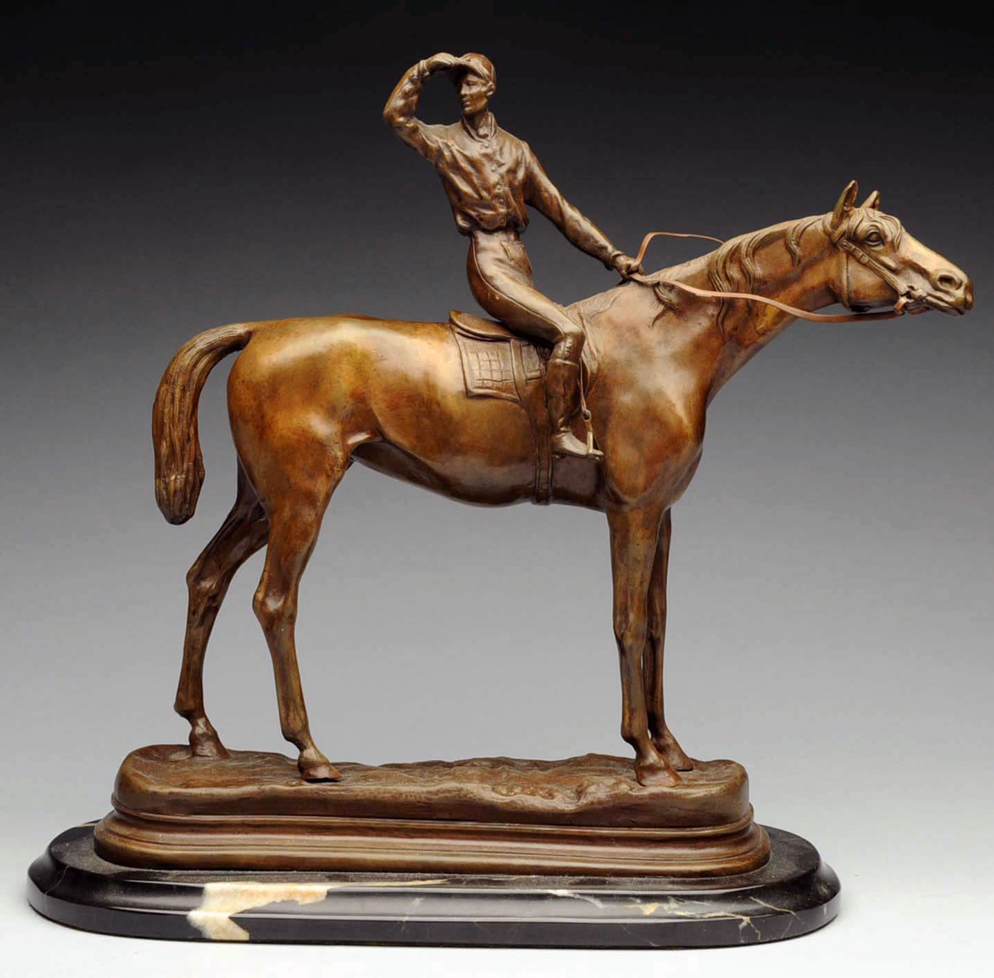 Bronze of jockey riding horse by P.J. Mene, marble base, 14 inches tall, excellent condition. Estimate: $2,000-$3,000. Morphy Auctions image