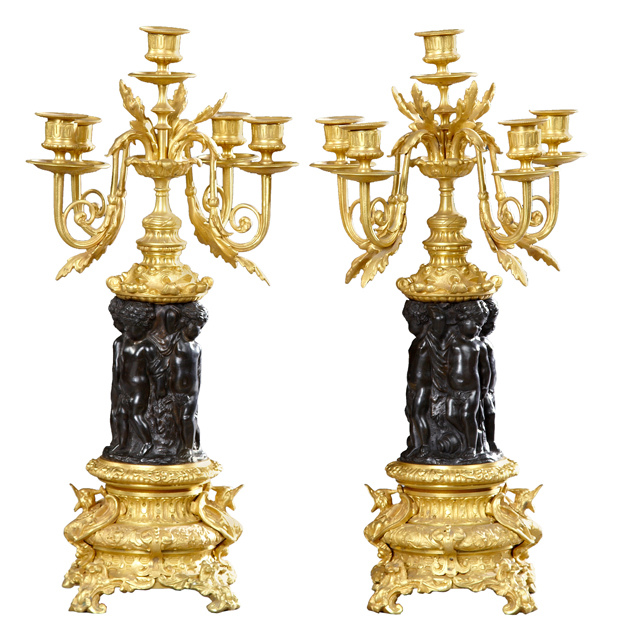 Pair of French gilt and patinated bronze five-light candelabrum, 19th century, with putti supports. Estimate: $2,000-$3,000. Crescent City Auction Gallery image 