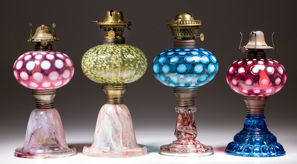 Selection of kerosene lamps, including many opalescent examples. Jeffrey S. Evans & Associates image