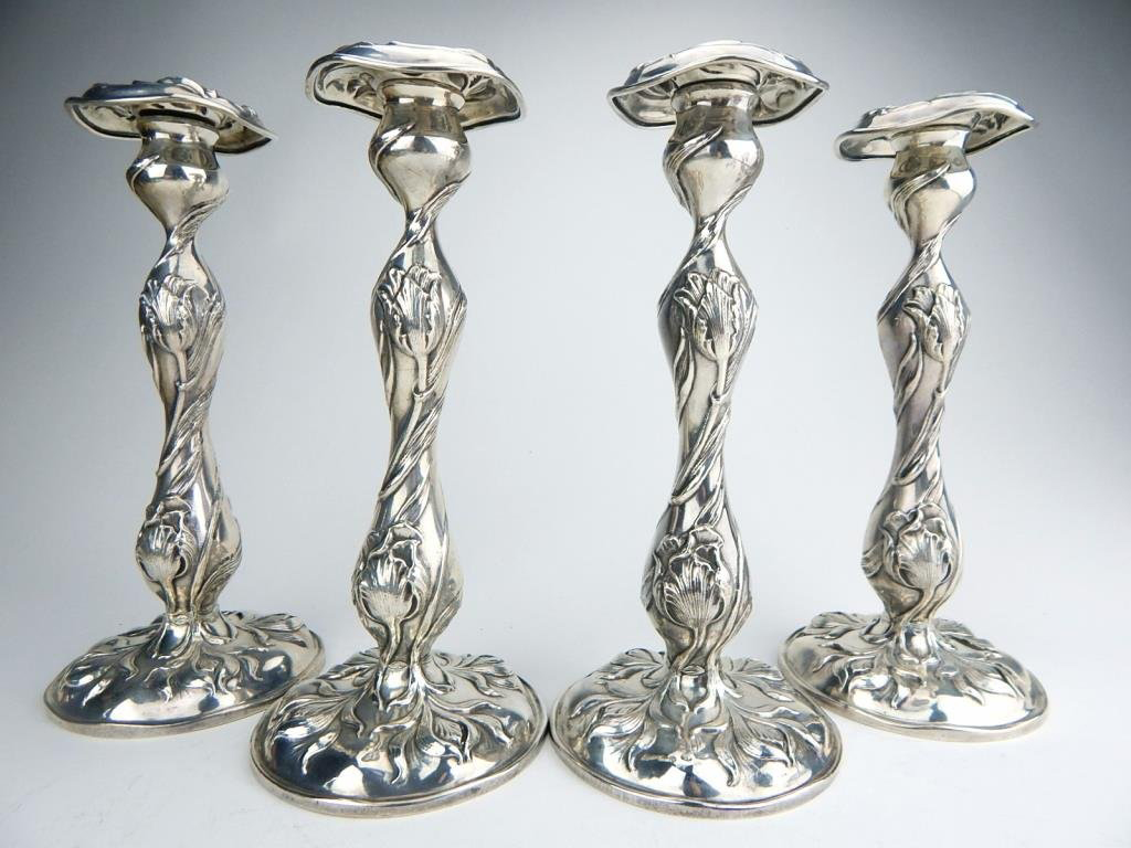 Set of four Art Nouveau silver candlesticks, marked ‘The Cowell & Hubbard Co. Sterling 925,' 10 1/4in. Estimate $1,200-$1,500. Don Presley Auctions image
