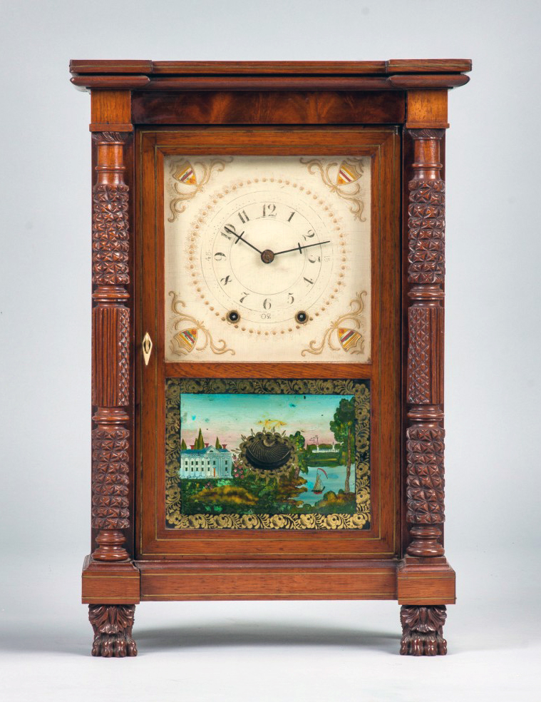 Rare miniature Mark Leavenworth shelf clock with figured mahogany case, banded inlaid brass, full carved pineapple columns and claw feet. Estimate: $25,000-$30,000. Cottone Auctions image