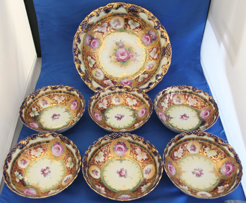 Very rare Shimamura Sei 7-piece fine porcelain berry set, Japanese, circa 1895-1905, hand-painted and scrupulously hand-gilded, produced for home market only. Est. $800-$1,200. Charleston Estate Auctions image