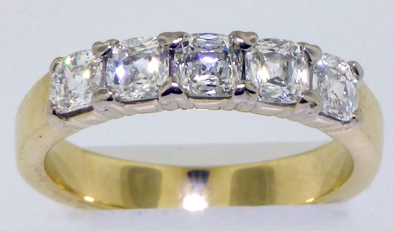 Estate diamond ring in 14K yellow gold featuring five prong-set, square, cushion-cut diamonds. Est. $4,000-$4,800. Charleston Estate Auctions image