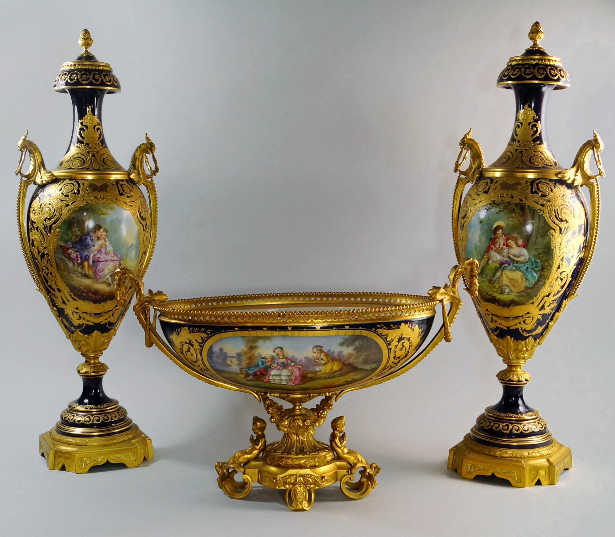 Pair of Sevres ormolu mounted porcelain vases, 19th century, with lids, signed Lancry, 27.6in high, together with a matching oval comport. Estimate: £5,000-£8,000. Roseberys image