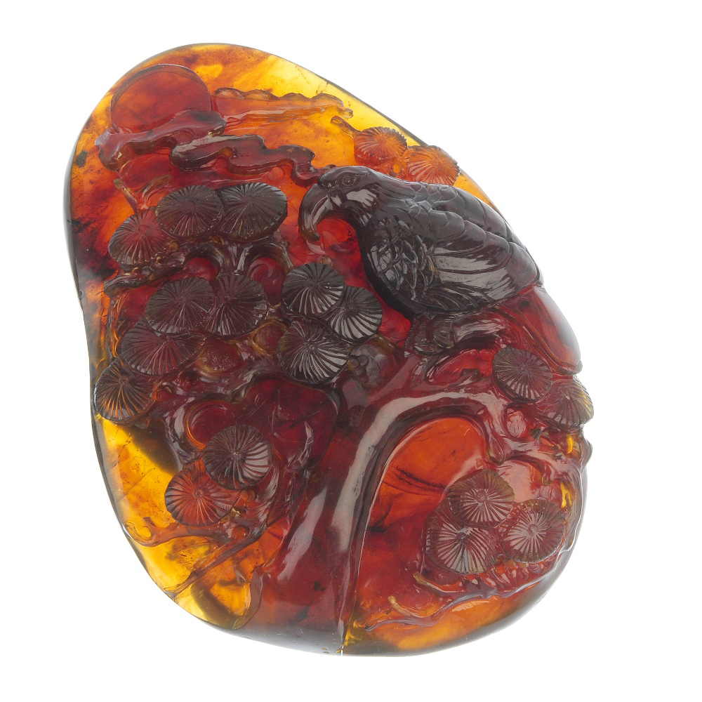 Burmese natural amber carving of parrot on Japanese pine tree branch. Fellows image