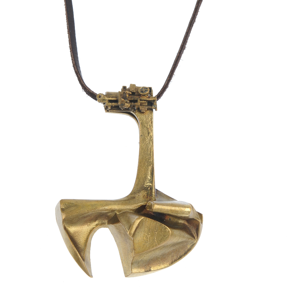 Bronze pendant by Bjorn Weckstrom titled 'Lapponia,' suspended from leather cord. Fellows image