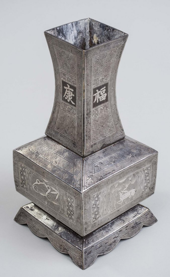 Korean silver inlaid copper and iron vase, 19th century. Sold for $10,200.