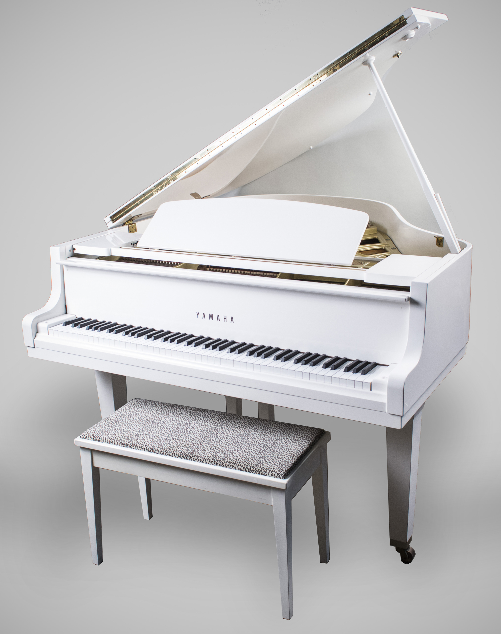 Yamaha baby grand paino, white lacquer finish. Sold for $5,700.