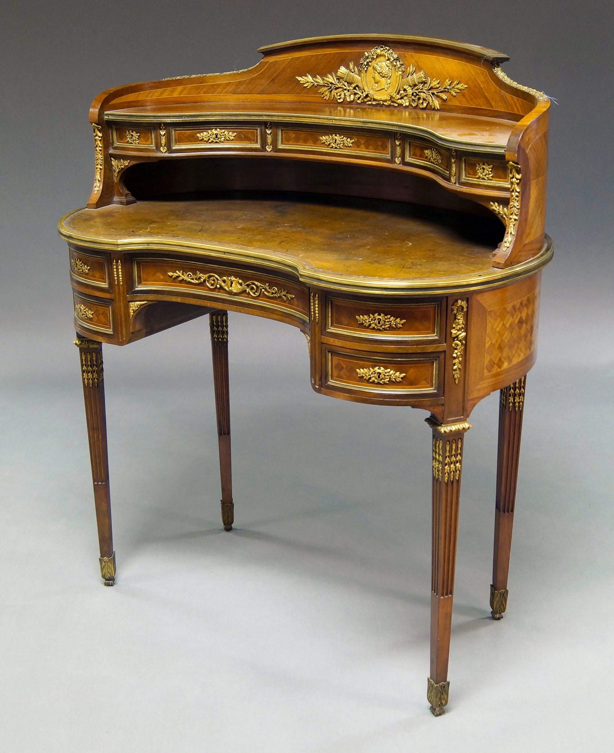 Early 20th century French ormolu mounted kidney shaped writing table in the Louis XVI-style. Price realized: £5,166. Roseberys image