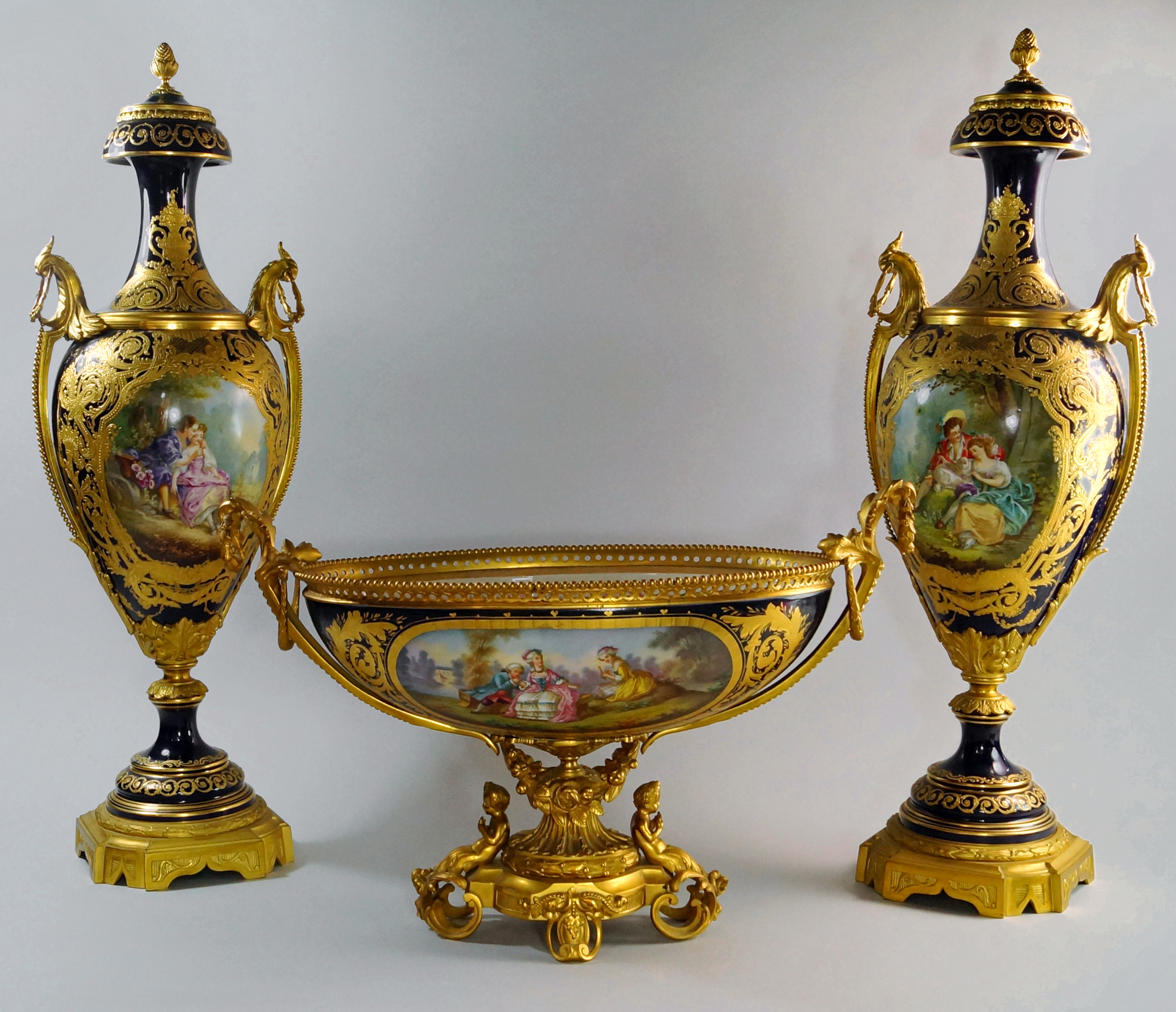 A pair of 19th century Sèvres ormolu mounted porcelain vases with matching oval comport sold for £8,856. Roseberys image