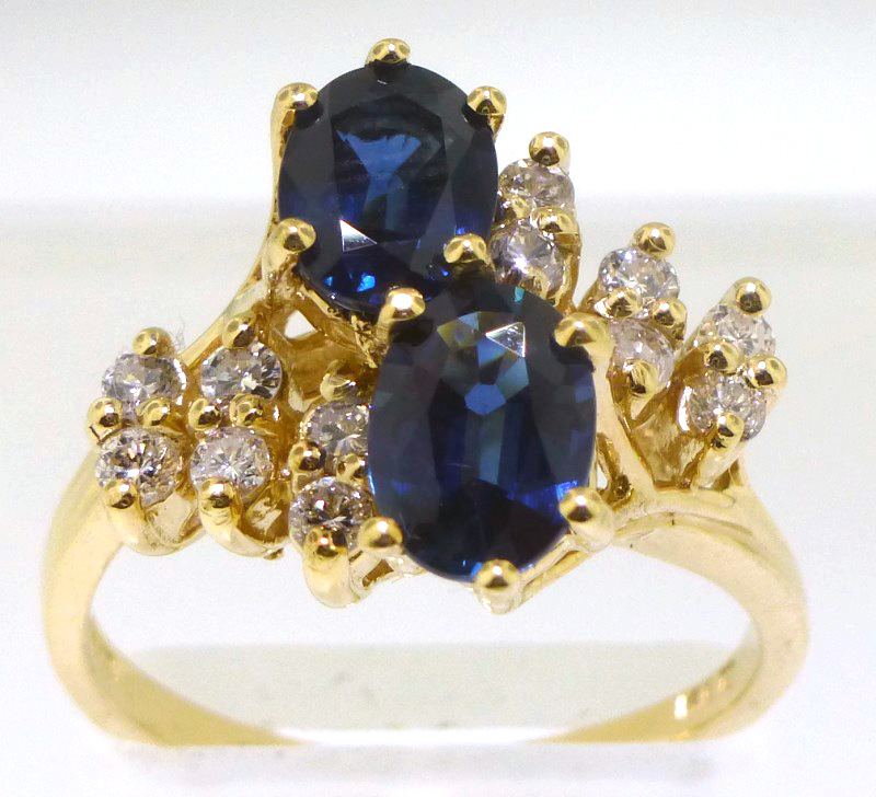 Estate sapphire and diamond ring, 14K yellow gold, sapphires measure 6.90 x 5.00mm and 6.70 x 4.90mm, surrounded by 12 round, brilliant-cut diamonds. Est. $1,600-$2,000. Charleston Estate Auctions image