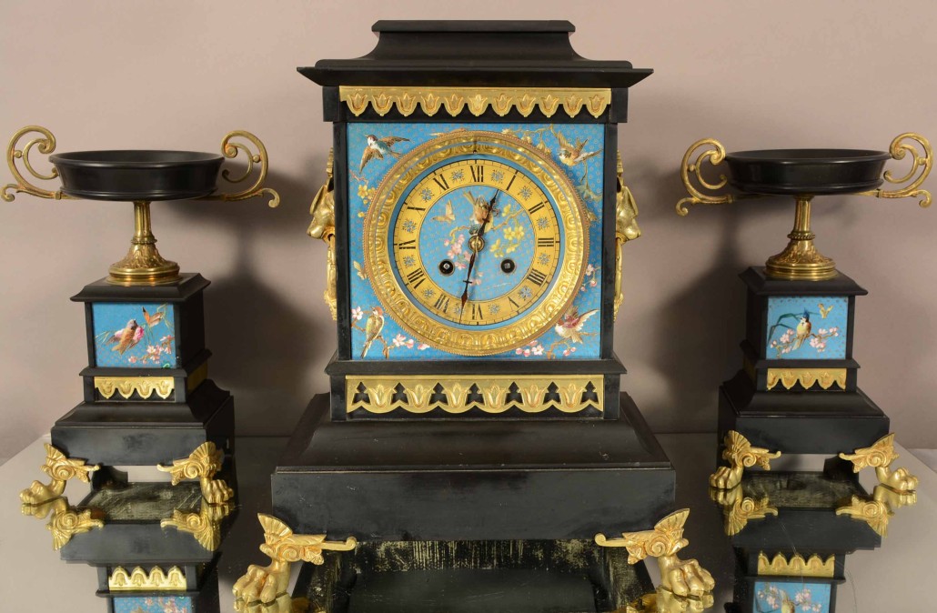 Lot 119 – French Louis XIV marble and cloisonne, three-piece clock set with cloisonne dial, decorated with birds and flowers, time and bell strike, with two matching side compotes. Signed Jappy Freses movement, circa 1875. Bruhns Auction Gallery image