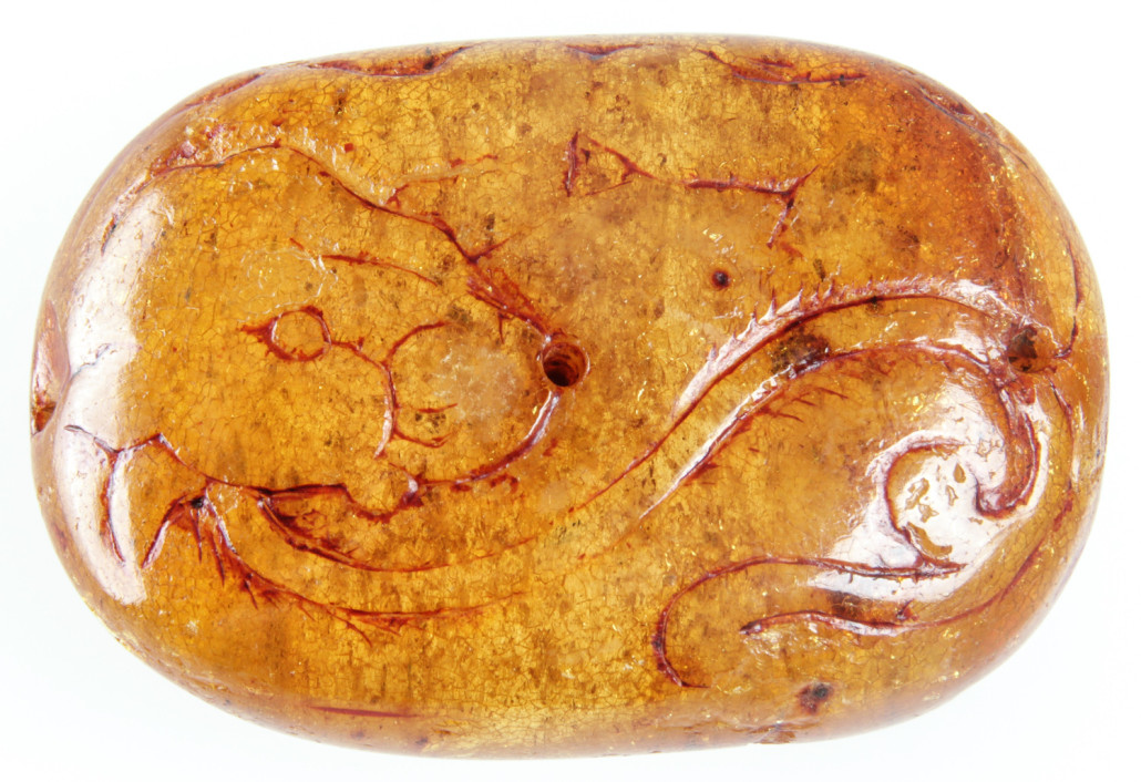 Lot 16 – Chinese amber amulet, Ming Dynasty (1368-1644). Size: 1.5in x 2.25in (3.75 x 5.75 cm). Estimate: $2,000-$3,000. Material Culture image