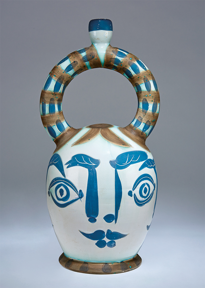 Pablo Picasso, Aztec Vase with Four Faces (R.401), 1957. Turned vase of white earthenware clay, decoration in engobes, knife engraved, paraffin, white enamel, #35 of 50, Madoura. Incised "EDITION/PICASSO/35/50/MADOURA"; retains "Madoura Plein Feu" and "Edition Picasso" stamps. 21.5" x 10.5" diameter. Ramié #401. Literature: Pablo Picasso: Catalogue of the Edited Ceramic Works 1947-1971. A. Ramié. 1988. #401. Estimate: $50,000-$70,000. LAMA image