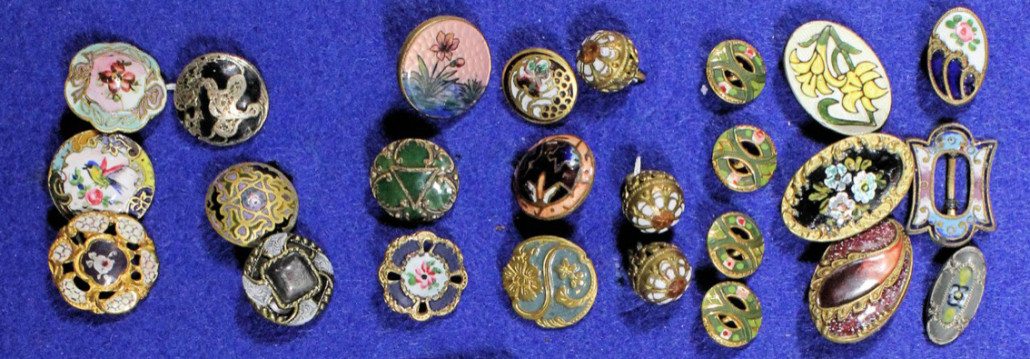 Part of a group of late 19th century French gold-plated and enamel buttons decorated with flowers. They were among a lot sold for £290. Photo The Canterbury Auction Gallerie