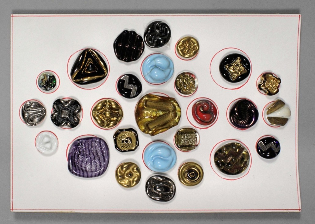 A group of 20th century pressed glass buttons by Bimini and Orplid, part of a lots sold for £280. Bimini was a glassworks founded by Fritz Lampl in Vienna in 1923. Lampl changed the name to Orplid when he immigrated to England in 1938, building a furnace in the basement of his home in London. Photo The Canterbury Auction Galleries