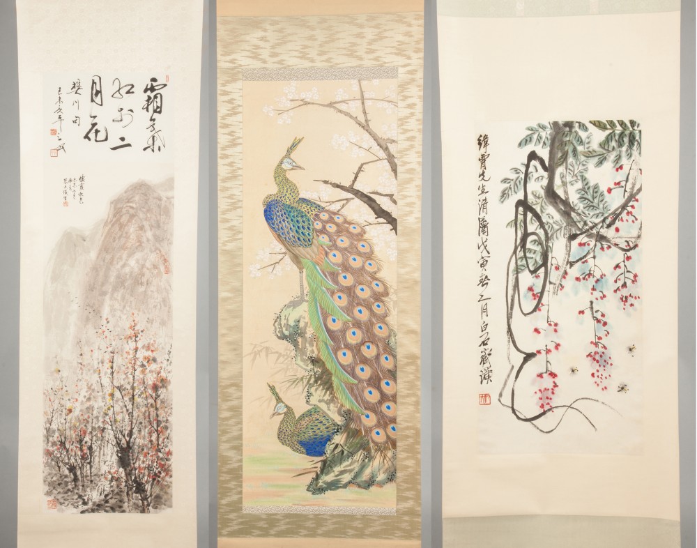 Trio of Japanese and Chinese painted scrolls, two of them signed by Chang Wen Jun (b. 1918), depicting a mountain landscape, a peacock and blossoms and bees. Price realized: $80,500. Cottone Auctions image