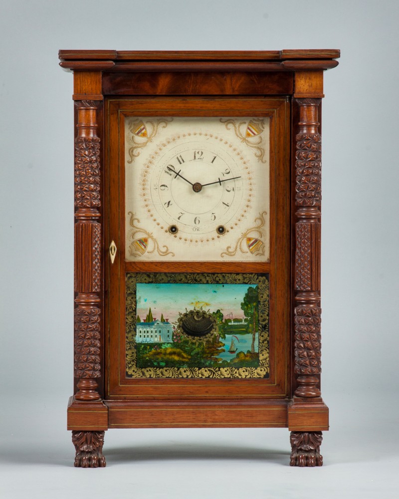Rare miniature Mark Leavenworth shelf clock with figured mahogany case, banded inlaid brass, full carved pineapple columns and claw feet. Price realized: $31,050. Cottone Auctions image