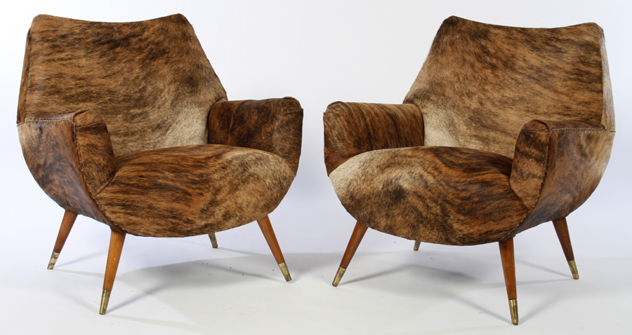 Mid-centruy modern cowhide club chairs. Kamelot image