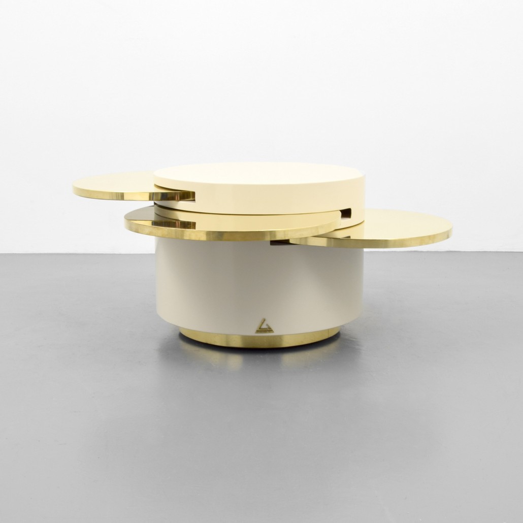 Gabriella Crespi ‘Elisse’ coffee/occasional table with four retractable leaves, Italian, lacquered wood and brass, est. $10,000-$15,000