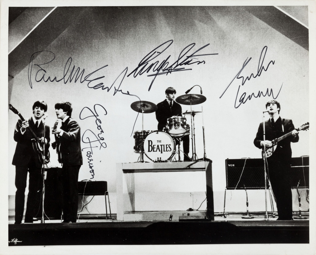 The Beatles autographed photograph by Dezo Hoffmann of the band performing at the Empire Theatre, Liverpool on Dec. 7, 1963. Heritage Auctions image 